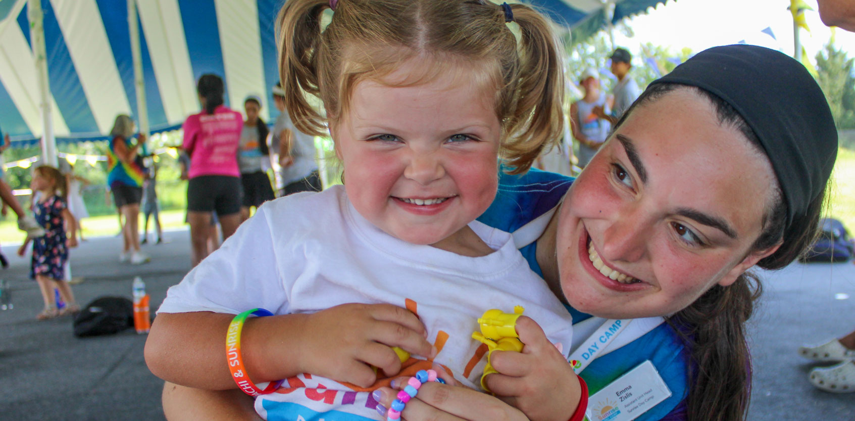 camper and counselor smiling